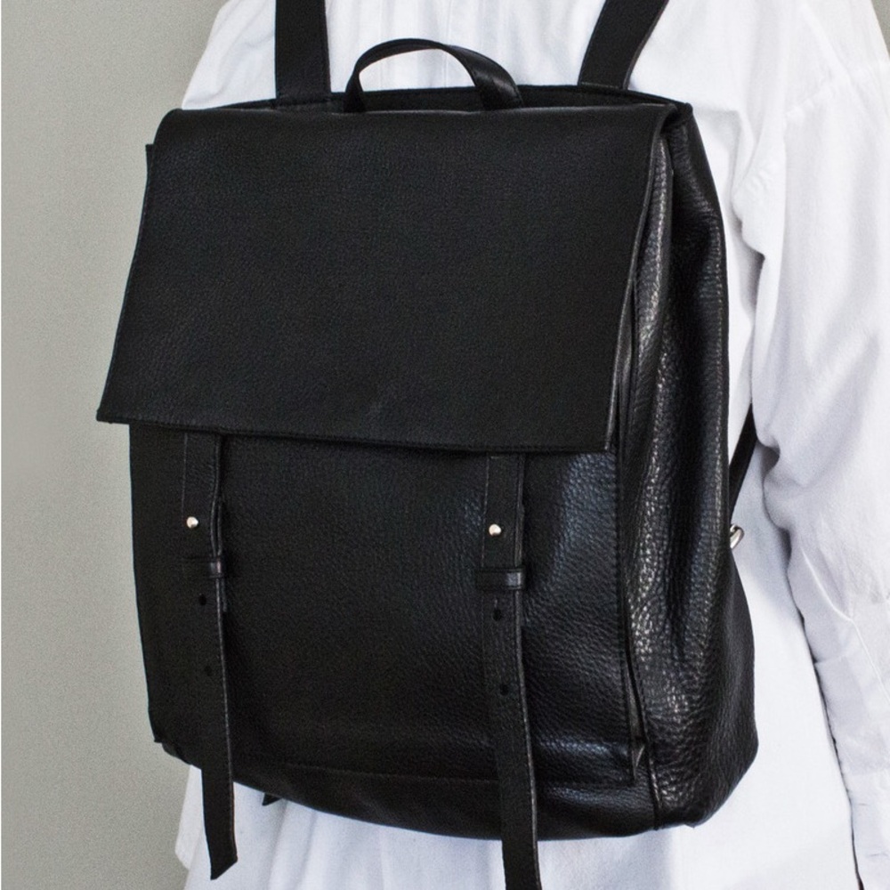 Black leather harness backpack from Le Bas. Made in Argentina